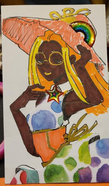 A rainbow and sunshine themed character with a big straw hat.