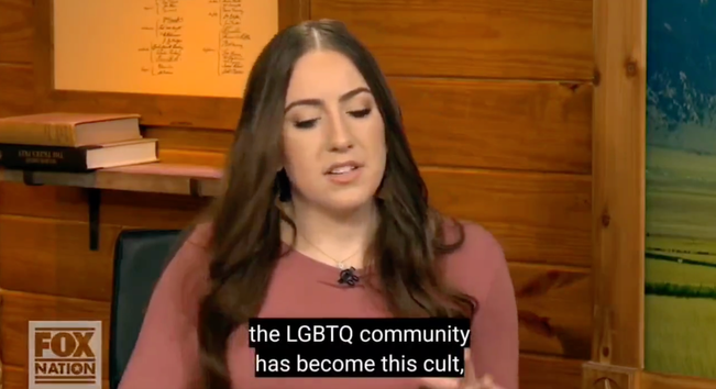 A still video from Chaya Raichik's Tucker Carlson appearance with subtitles that read "the LGBTQ community has become this cult,"
