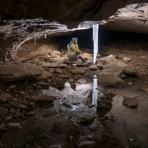 Person looks at a nice ice formation, this image is more of the scene and the last was a close-up. This one has me, Amata, in it :)