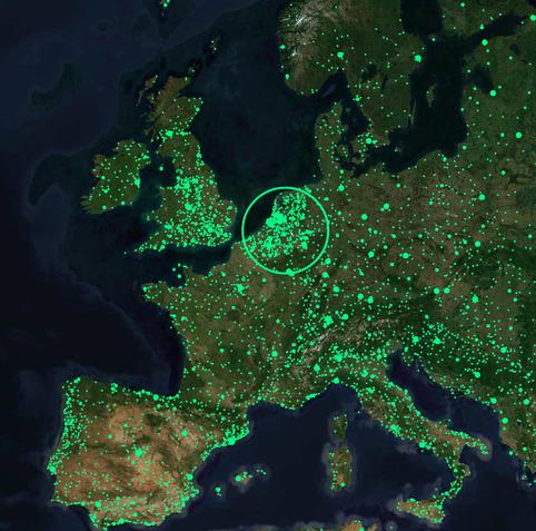 A satellite map is shown, covered with tiny green dots, each representative of a radio station.