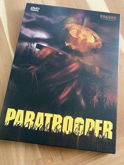 Dvd cover with a scarecrow with a jack o lantern head.