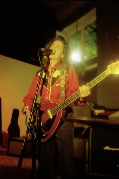 Toody Cole, wearing her signature western shirt while playing a Vox Teardrop bass at Backspace in Portland Oregon.