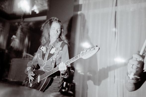 Toody Cole, wearing her signature western shirt while playing a Vox Teardrop bass at Backspace in Portland Oregon.