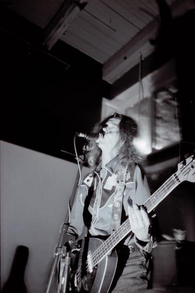 Toody Cole, wearing her signature western shirt while playing a Vox Teardrop bass at Backspace in Portland Oregon.