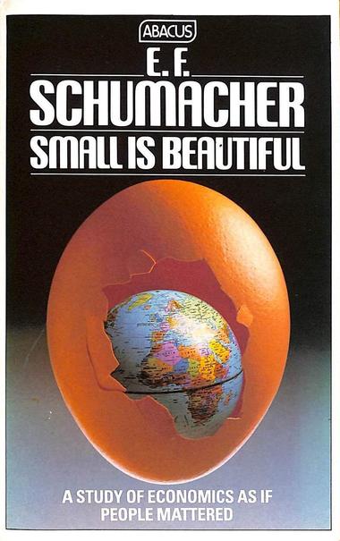 A photograph of an early (the first? Not sure) edition of EF Schumacher’s 1973 book Small Is Beautiful, with a small globe inside an orange egg that’s partially hatched