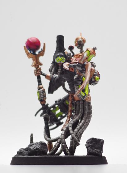 A darkly robbed figure points towards you, gazing upon you with an inscrutable array of green glowing eyes. Their figure is obscure by machinery, both familiar ad alien, and various cables. In their opposing hand, they wield a scepter adorned with a magenta sphere of glowing energy.