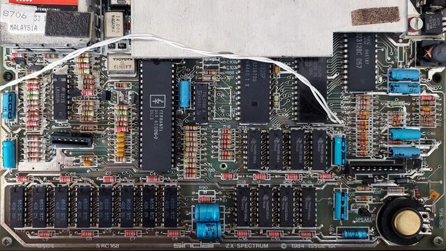 a ZX Spectrum+ motherboard, lots of electronic components and chips are visible