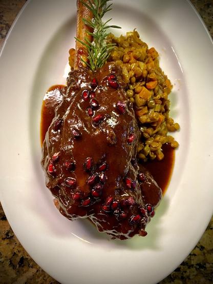 Lamb is plated with lentils.   This is yet another recipe inspired from my paternal grandmother's region.  I also picked up some ideas doing a culinary internship there.