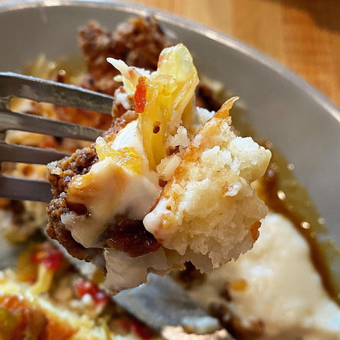 “Perfect bite” containing all ingredients on a fork