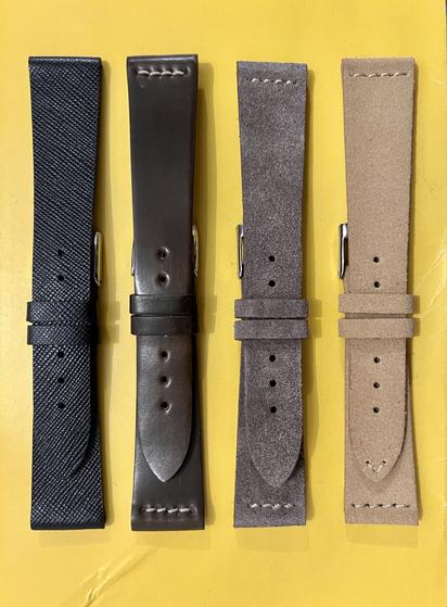 Quartet of leather watch straps: black, brown, taupe, and tan