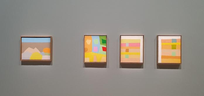 View Exhibition four small scale paintings of etel adnan, 2010s, the colour scheme ist yellows, beige and light blues.