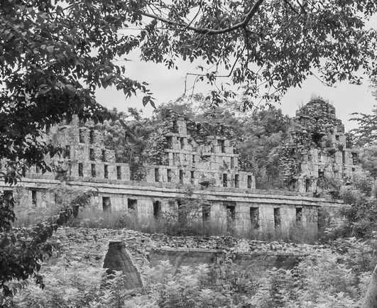 Ruins of buildings at Uxmal in black and white.