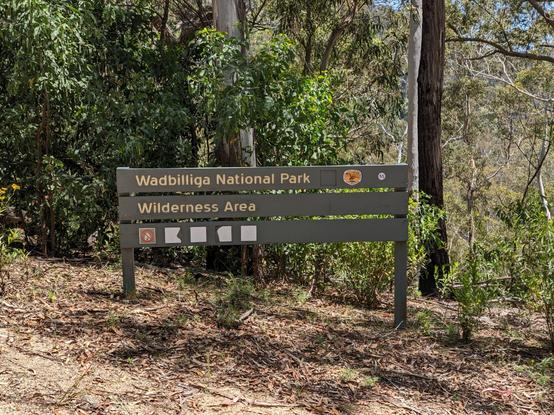 A National Parks and Wildlife Service sign within the Wadbilliga National Park designating the wilderness area. This sign is at the crossroads of the Brogo and Warrigal firetrails.