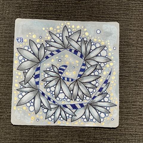 A grey Zentangle tile piece of art on a classic size. Dark and Light Blue ink with metallic gold highlights, graphite shading with white and blue pastel chalk.