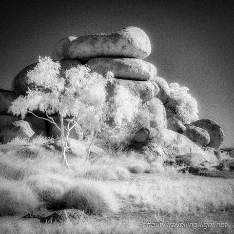 Black and white infrared photo of Ghost Gum & Devil's Marbles, Northern Territory, Australia.