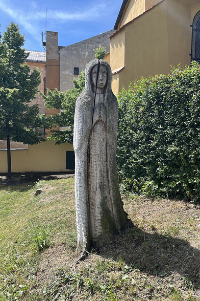 Tree carved into shape of religious figure