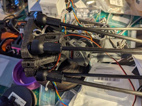 Side shot of my new delta effector system for 3d printers currently underway. Direct drive based delta extruder, and a 50mm blower. Removable magnetic probing system to cut some weight. Igus arm joints