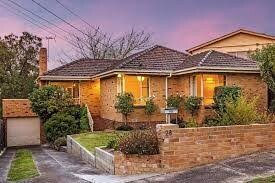 Triple fronted post war Australian suburban home
