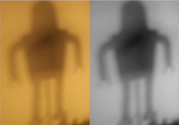 Dyptich of shadows cast from robot shadow puppet.
