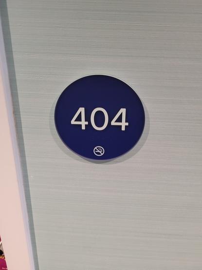 Hotel room door with room number "404" on it.