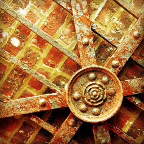 brick and rusted metal in a radial pattern