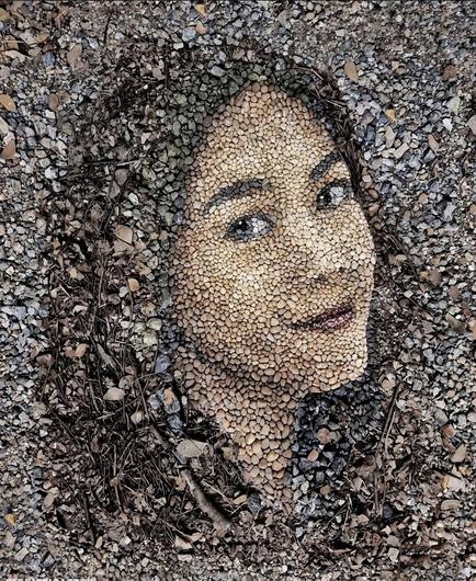 Street art. Mosaic laid from gray and yellow stones. Portrait of Nwe Darli Htun, an
Burmese actress and Model.
