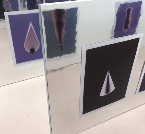 Installation shot from a microgallery called One To Ten Gallery. Showing instant colour photograms mounted on mylar