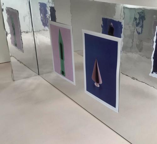 Installation shot from a microgallery called One To Ten Gallery. Showing instant colour photograms mounted on mylar