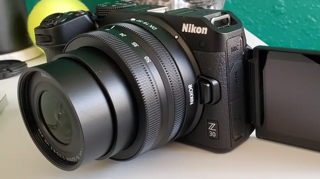 Photo of the Nikon Z30 with its LCD Screen extended out.