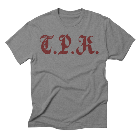 Grey t-shirt, red letters: T.P.K.
With the words, GUILT-FREe in the top of the T.