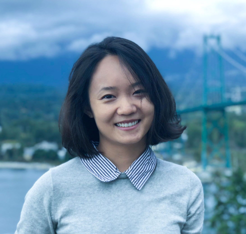 Photo of Hanlin Li with a river and mountain in the background.