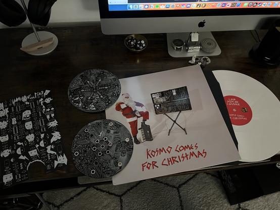 Look mum no computer holiday LP. Circuit boards designed by Sam. My computer desk. Tilt 5 dice, and coffee mug.