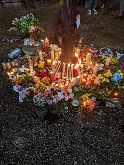 Memorial for Tort with candles and flowers.