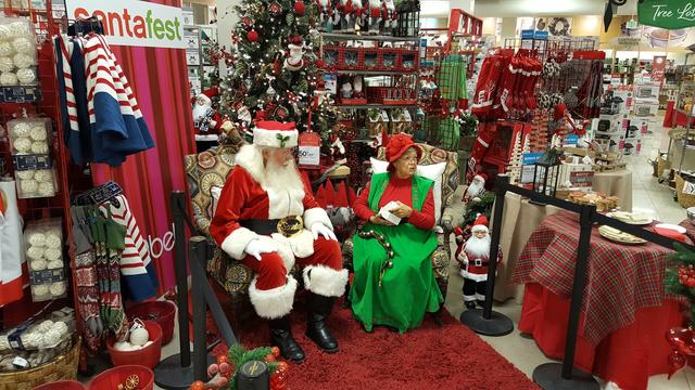 A department store Santa and Mrs Claus await guests at Belk's Santa Fest event on November 10, 2018 in Florida.