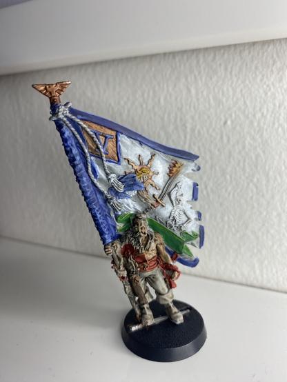 Update on progress with the whites and blues tidied up to pop a little more. Some base coats and a wash done on the standard bearer.