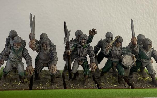 A 10 man unit of swordsmen in the green and white livery of the Stirland River Patrol.