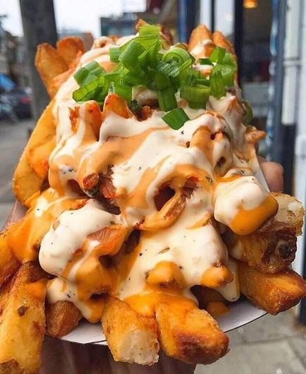 Chips or fries covered in mayonnaise with a sprinkling of chopped spring onions on top. This picture is unrelated to the recipe and is likely to be much more tasty