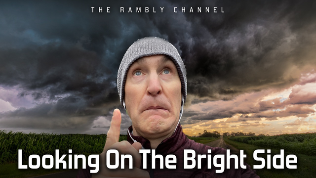 A runner looking nervously at dark rain clouds. Caption “Looking on the bright side”