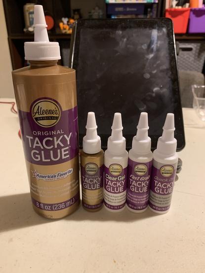 Same 4 bottles from previous pic on left, 8oz bottle of Aleene’s original tacky glue for size comparison