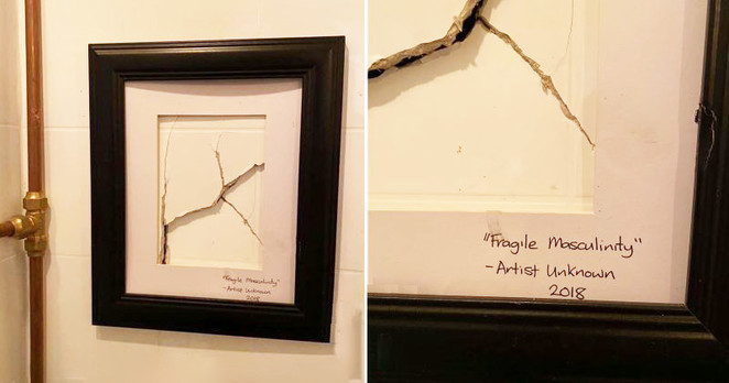 First picture shows the hole with a picture frame around it. Second picture is a closeup of lower right of frame with words “Fragile Masculinity” / - Artist Unknown / 2018