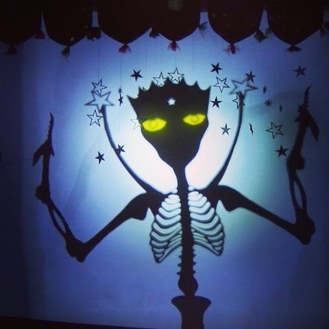 This is the shadow puppet for the character “The Djinn of the Stars” from our concert “The Thief of Stars”. It is a intimidating skeletal figure with large bright yellow eyes and hands resembling a Kris dagger or praying mantis raptorial.