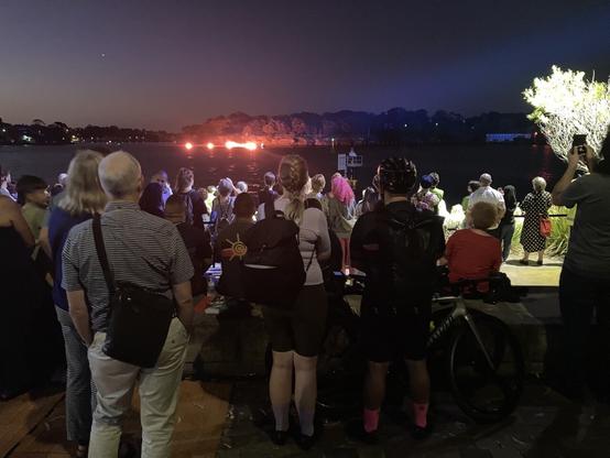 Crowd  & illuminated eel