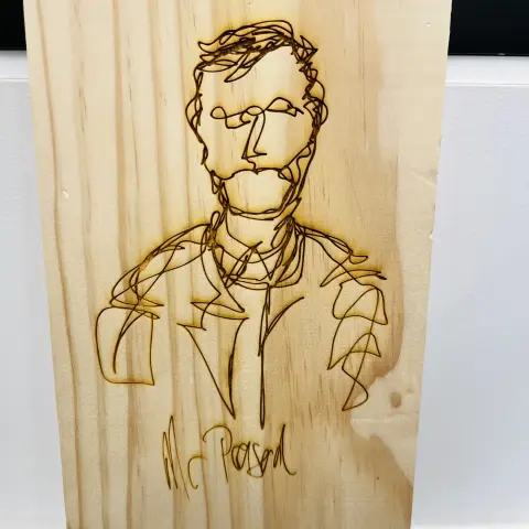 A laser burned drawing of a continuous line drawing done on wood
