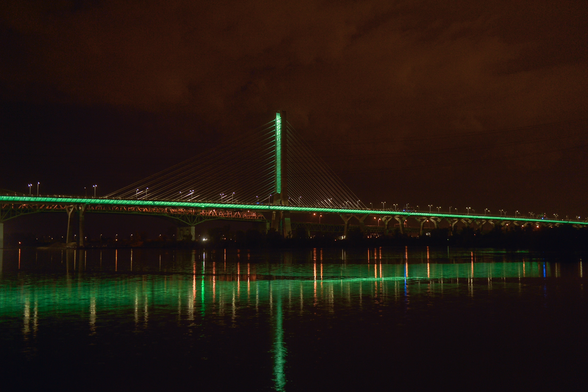 "The Samuel De Champlain Bridge is lit up in green to commemorate the victims and survivors of the Quebec City mosque attack and other Islamophobic crimes." 

— Infrastructure Canada