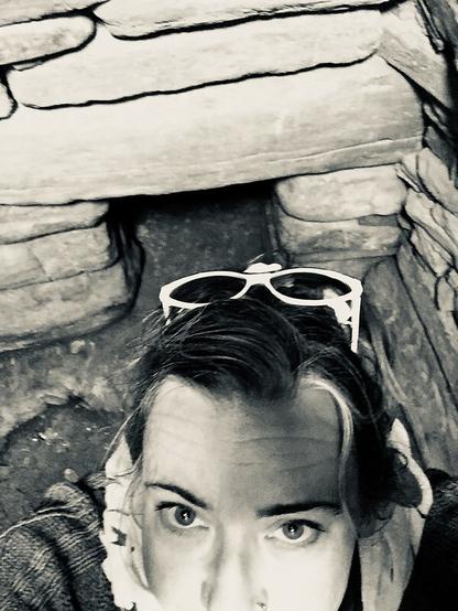 B&W shot of a slightly bedraggled white woman inside the central chamber. (It's me!)