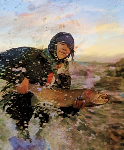 Numu Wanderer, the first Paiute women fishing guide, wrestles with a huge cutthroat trout while the waves of Pyramid Lake crash against the towering tufa of the shore.