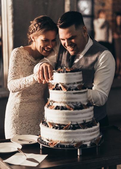 The photo of the bride and groom cutting the wedding cake together.