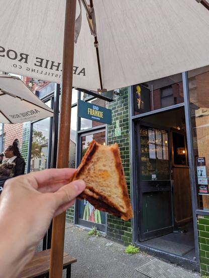 Jaffles being held up into front of bad Frankie's store front