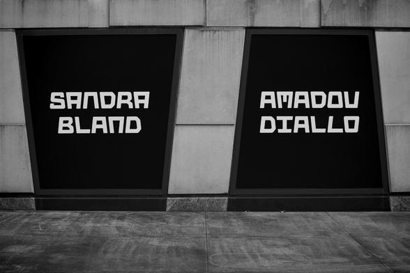 A black-and-white photograph created by photographer Victorio Milian. It shows a window display at The Africa Center, located on 110th Street and Fifth Avenue. It shows the names of Sandra Bland and Amadou Diallo. Both were murdered by police.