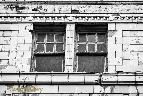 Old windows in a broken building facade.